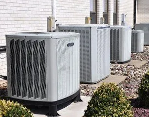 Outdoor condensing units lined up at a service install